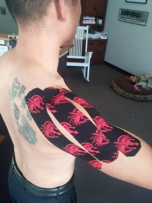 Dr Bruce "rocking" Rock Tape!