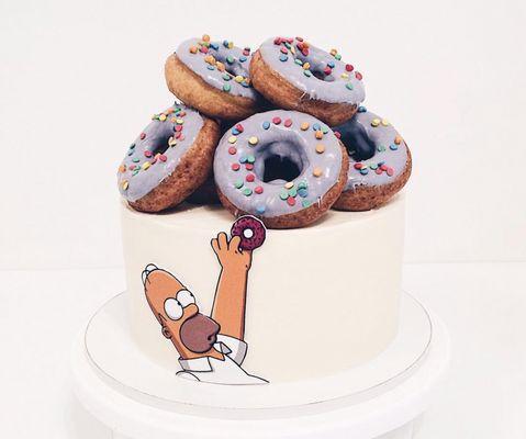 Custom cake, nutty sponge cake, print decor and our special donuts.