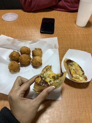 The hush puppies balls were good. The bread with cheese and jalapeños and meat was good too.