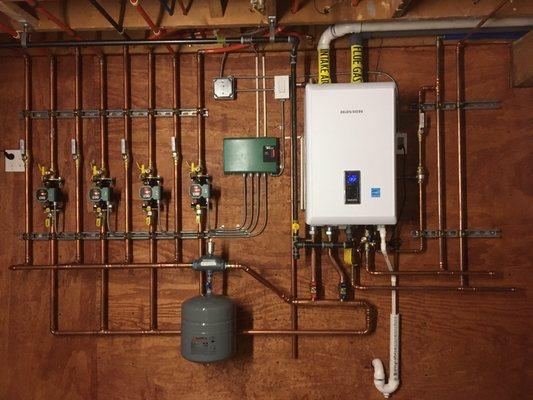 Navien high efficiency 4 zone heating and domestic hot water system.