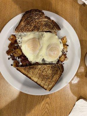 Corned beef hash, eggs over easy, and sourdough toast !  OMG, I spoil myself.