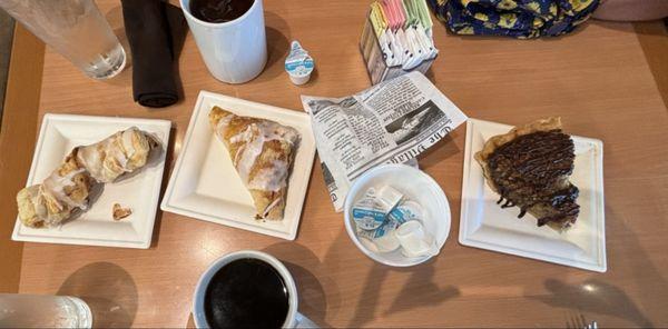 L-R: Almond pastry, cherry turnover, molasses cookie (inside newsprint-style wrapper), and pecan/chocolate/coconut pie