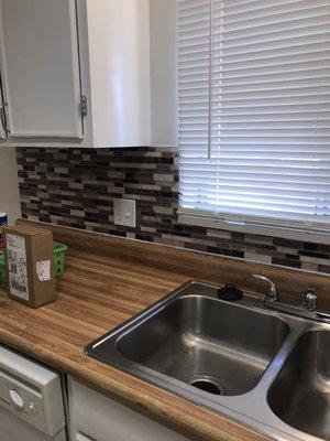 Backsplash installed , cleaning , painted whole place, new blinds installed