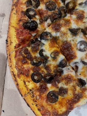 Burnt, dried out pizza with cardboard crust