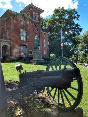 The front of the Fenton history Center including the Statue of former NY Governor Reuben Fenton and the cannon.