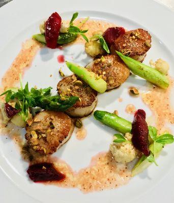 Seared scallops with warm asparagus salad, burnt blood orange and pistachios.