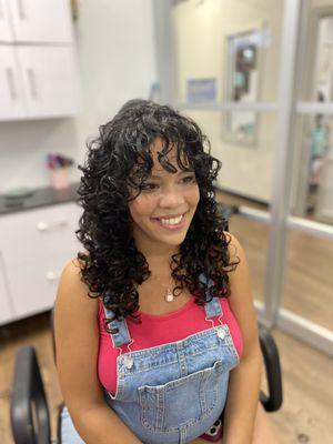 Curly haircut with bangs