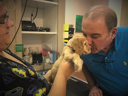 Dr. Fenster and tech Devon showing some puppy love