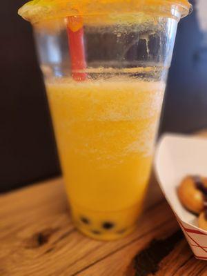 Passionfruit Tea with boba. Not real tea, more of an artificially flavored smoothie with boba.