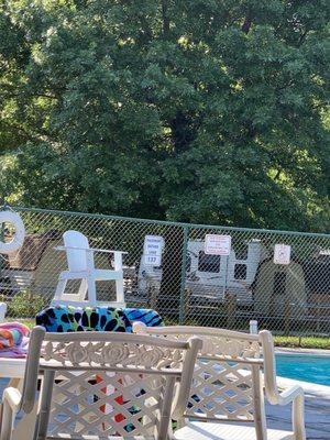 Empty lifeguard chair because the lifeguards would rather sit together and talk.