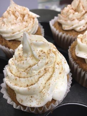 Gluten Free Cinnamon Roll Cupcake with Cream Cheese frosting sprinkled with cinnamon