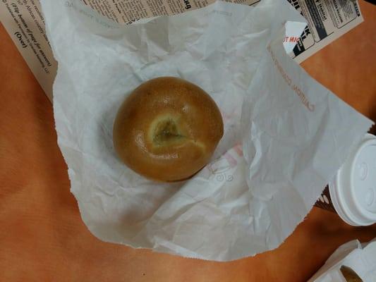 There is some sort of weird substance in the middle of this plain toasted bagel...I'm scared to eat this