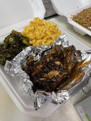 Jerk chicken with macaroni and cheese and collard greens