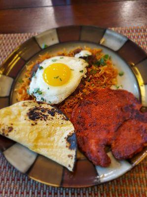 Fried marinated pork chop (with my rice and beans and a fried egg on top). Seriously obsessed with these!