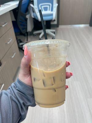 Iced Americano coffee w/half sweet hazelnut flavor *chef's kiss*