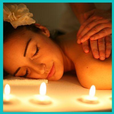 Enjoy a relaxing massage with the warm amber glow of candles.