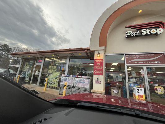 Outside. Attached to a gas station, had a connection door inside.