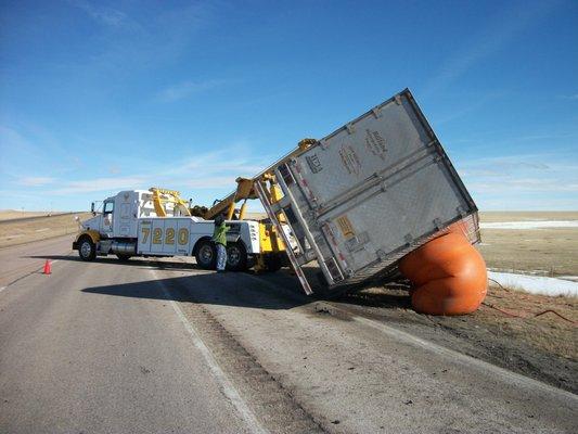 Our 7220 heavy duty wrecker righting a semi truck during an airbag recovery.