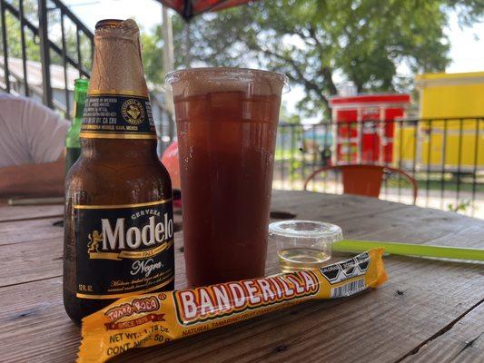 Michelada w negra modelo, tasty! Comes with a tamarindo stick