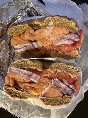 Lox, onion, and tomato on a whole wheat bagel! Generous portion size! Yum! Nice staff too!