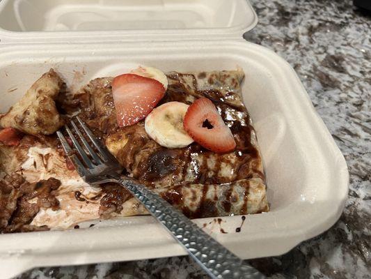 Forgot to take the full photo before I started to eat it haha strawberry banana Nutella crepe.. still half left after eating half!