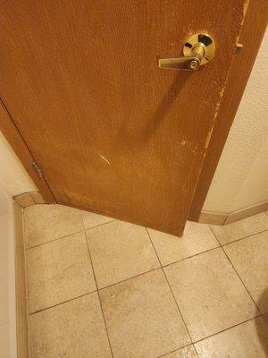 Worn dirty door and tile