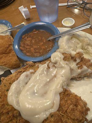 Senior Pork Chops ( fried) , potatoes , pinto beans  and plenty cream gravy !! And what a deal 9.99