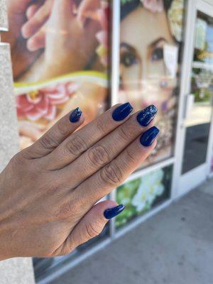 Navy blue and silver sparkle nails