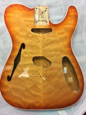 Thinline with a quilt maple top