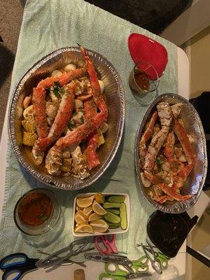 King Crab leg feast with shrimp, scallops, potatoes, corn, sausage, cucumber