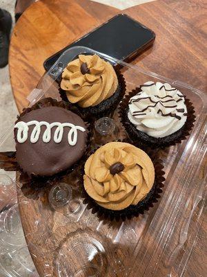 Chocolate with cream in the middle (chocolate with white swirl), two chocolate espresso, and one devils chocolate (with white frosting)