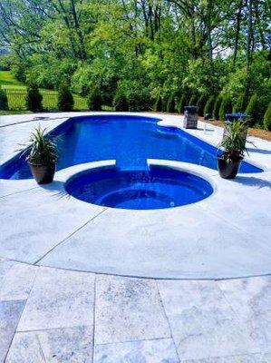 Travertine patio surround fiberglass swimming pool