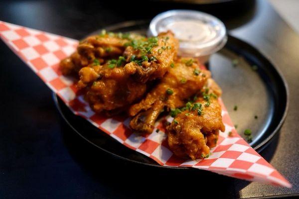 6 wings with buffalo sauce and a side of vegan ranch.