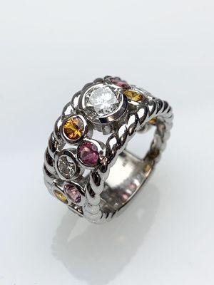 Custom "Mother's" ring with Diamonds, Yellow Sapphires, and Pink Tourmalines set in 18kt.