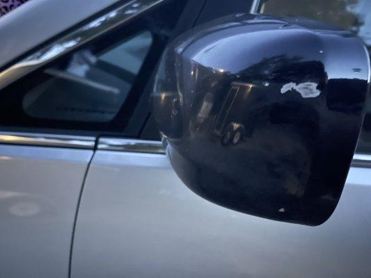 Scuffs on driver mirror