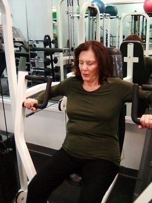 Chest press,she is pretty strong!