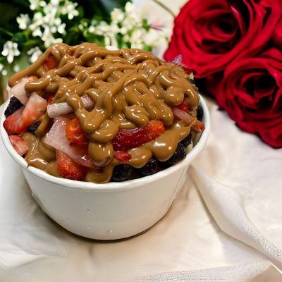 A loaded açaí bowl smothered with cookie butter