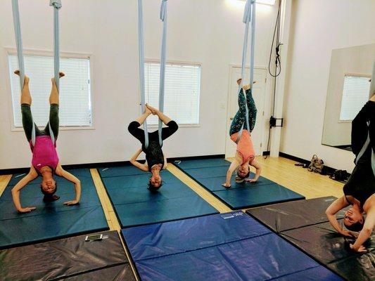 My friends and I hanging out in our first Aerial Yoga class with Amber