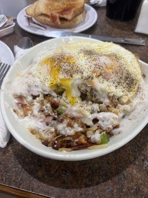 Hungry man skillet with extra gravy &  over easy eggs.