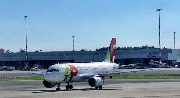 A TAP Air Portugal A32# is taxiing at Milan-MXP and headed for the queue to return to LIS