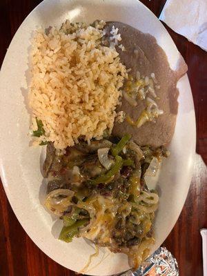 Alambres- strips of steak with bell pepper, onion, cheese , rice and refried beans. Their chips and salsa were also fire!