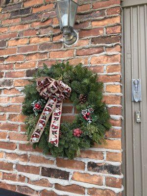 This is the wreath AFTER the Christmas Blizzard of 2022! We were ground zero for the snow bands and fierce winds.