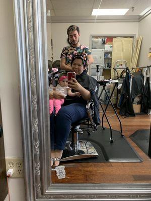 My hairstylist Richard and holding on my baby girl 5 months old while I get my hair permed!