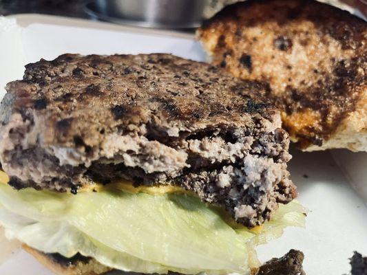 A build your own burger ordered medium.  Bread is burned on both sides and meat is dried out and gray.