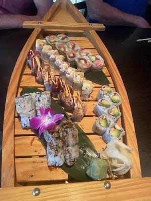 Our beautiful sushi boat with: Avocado Peanut Roll, Geisha Roll, Yellowtail Jalapeno, Red Lobster Roll, Snow Roll & Eel Avocado Roll