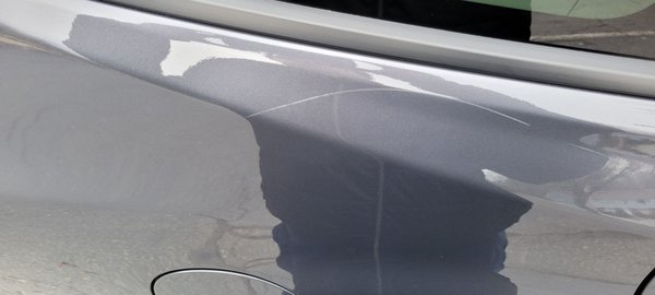 Scratch caused by their car wash.