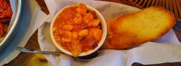 Cup of jambalaya with garlic toast