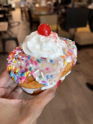 I think they called it the Izzy Piggy: 2 vegan donuts, chocolate icing in the middle, topped with whipped cream and a cherry. All vegan.