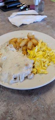 Home fries, scrambled eggs and biscuits and gravy. Totally worth 9.99 if it all was hot.