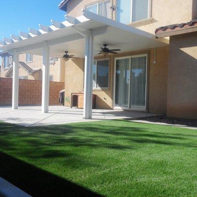 Maintenance free EasyTurf synthetic lawn and beautiful, insulated, aluminum patio cover.